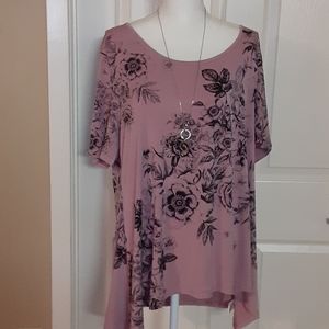 Ladies Blouse Mauve in color.
